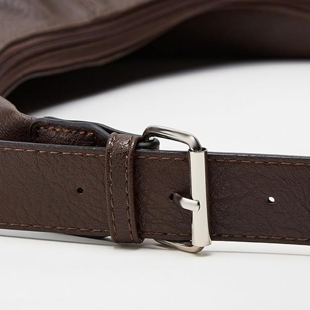 Leather belt with a silver buckle of a leather shoulder bag