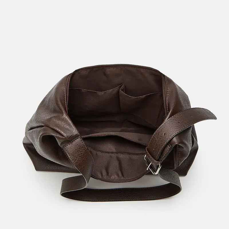 Interior and pockets of a leather shoulder bag