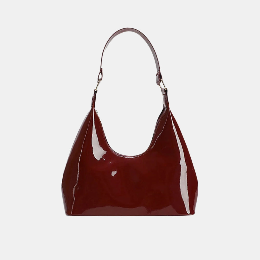 Small red glossy leather handbag and purse 