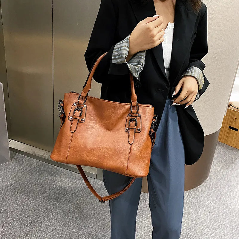 Woman wearing a leather handbag